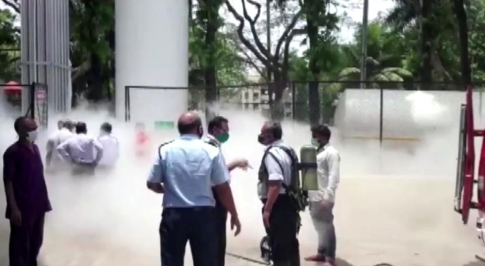 An oxygen tank is seen leaking outside a hospital in Nashik, Maharashtra state, India, on April 21, 2021, where 22 COVID-19 patients died due to to the leak cutting oxygen supplies to their ventilators. / Credit: ANI/Reuters