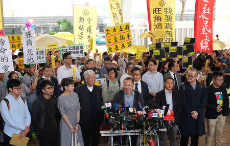 (L-R) Pro-democracy activists Cheung Sau-yin, Chung Yiu-wa, Tanya Chan, Chu Yiu-ming, Benny Tai, Chan Kin-man, Lee Wing-tat, Shiu Ka-chun and Raphael Wong arrive at the court before hearing a verdict on their involvement in the Occupy Central, also known as "Umbrella Movement", in Hong Kong, China April 9, 2019. REUTERS/Tyrone Siu