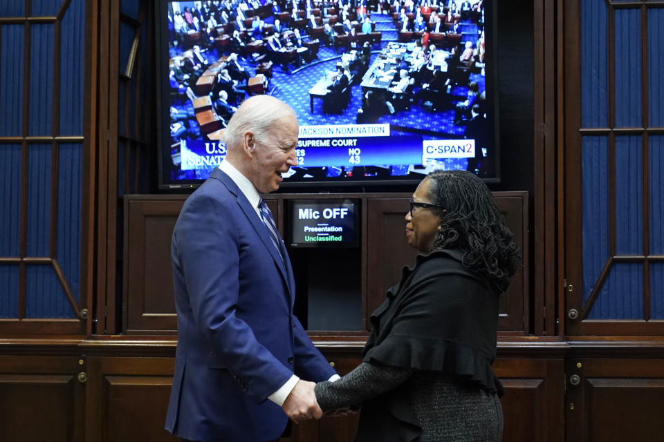 FILE - President Joe Biden and Supreme Court nominee Judge Ketanji Brown Jackson watch as the senate votes on her confirmation from the Roosevelt Room of the White House in Washington, April 7, 2022. (AP Photo/Susan Walsh, File)
