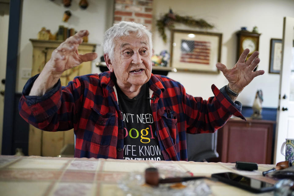 Peter Doak speaks to a reporter at his home, Wednesday, April 26, 2023, in Columbia Falls, Maine. Doak, an Army veteran, supports a plan to build the world's tallest flagpole on undeveloped land just outside of town. “To say that the flagpole with the United States flag on it is an eyesore, I don’t particularly like it. ... But they don’t mind looking out the window at cellphone towers or the windmills.” (AP Photo/Robert F. Bukaty)