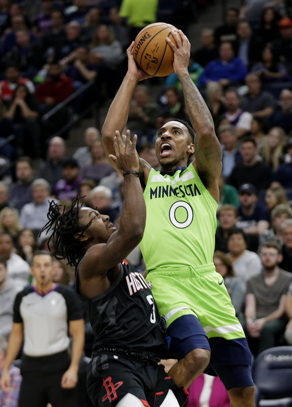 Minnesota Timberwolves guard Jeff Teague (0) shoots against Houston Rockets guard Chris Clemons (3) in the first quarter during an NBA basketball game Saturday, Nov. 16, 2019 in Minneapolis. (AP Photo/Andy Clayton- King)