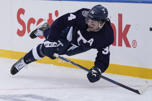 Morgan Rielly of the Toronto Maple Leafs cross checks Rasmus Dahlin News  Photo - Getty Images