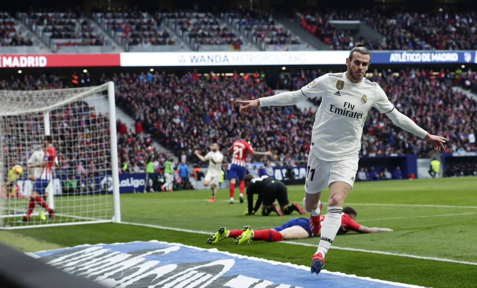 FILE - Real Madrid's Gareth Bale celebrates after scoring his side's 3rd goal during a Spanish La Liga soccer match between Atletico Madrid and Real Madrid at the Metropolitano stadium in Madrid, Spain, Saturday, Feb. 9, 2019. (AP Photo/Manu Fernandez, File)