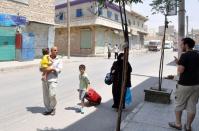 A Syrian family walks past closed shops as they flee the Shaar neighborhood of the restive city of Aleppo. Syrian rebels staved off a fightback by regime forces in Aleppo on Saturday amid growing concern about the risks of reprisals against civilians in the country's commercial capital