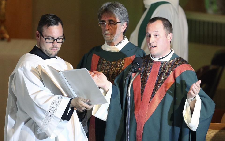 Priest Steve Lemay speaks during Messe Reconfort at Sainte-Agnes church in Lac-Megantic