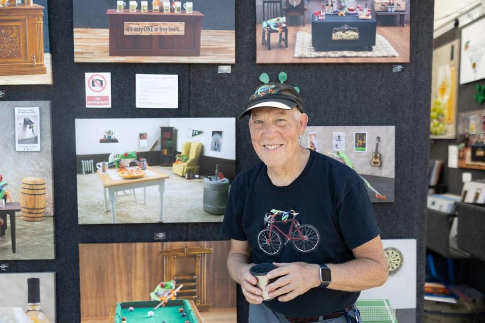 Pennsylvania photographer Steven Daniels stands by his specialty photos — those of living tree frogs in various domestic situations — during Belleville’s Art on the Square on May 18, 2024.