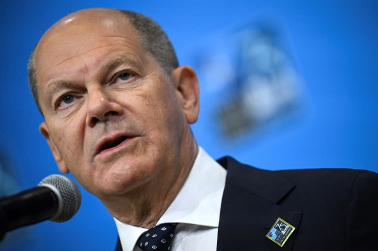German Chancellor Olaf Scholz speaks to reporters at the NATO 75th anniversary summit in Washington, where he hailed a US decision to temporarily station some long-range missiles in Germany (Drew ANGERER)