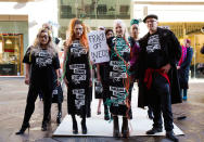 <p>Vivienne Westwood with a group of models and activists carrying a “Frack off Ineos” sign outside the Ineos headquarters. (Photo: GettyImages) </p>