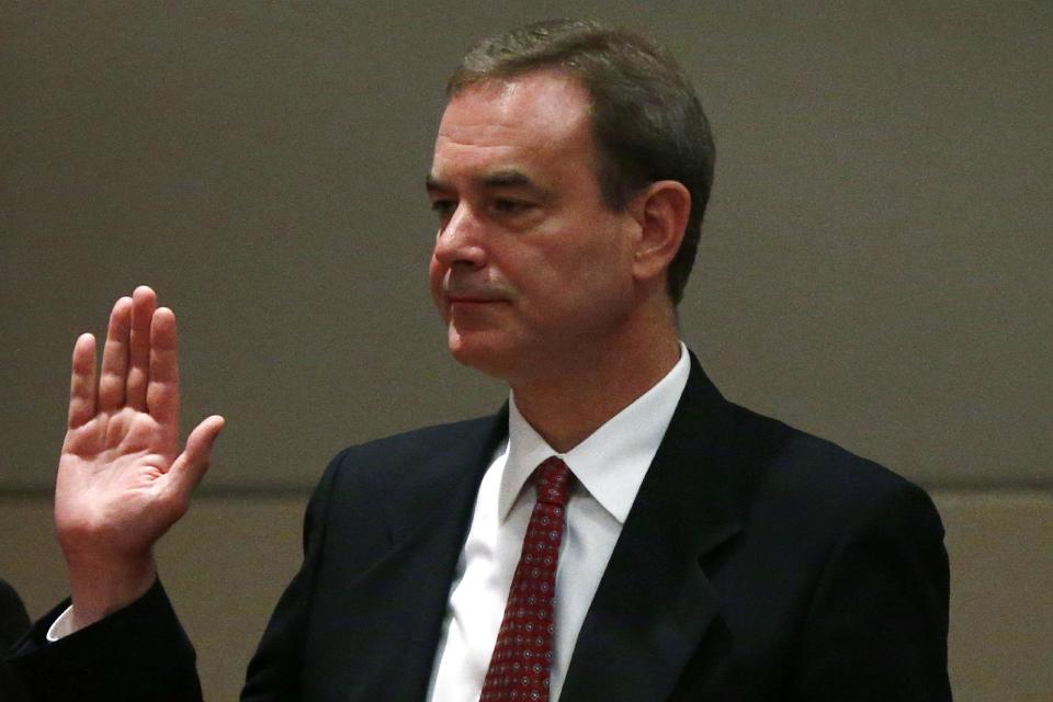 Boeing Commercial Airplanes Vice President and Chief Project Engineer Mike Sinnett is sworn in prior to testifying at a hearing investigating a battery fire aboard a Boeing 787, Tuesday, April 23, 2013, at the National Transportation Safety Board (NTSB) in Washington. (AP Photo/Charles Dharapak)