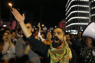 Protesters chant slogans as they block a highway during an anti-government protest in Beirut, Lebanon, Wednesday, Dec. 4, 2019. Protesters have been holding demonstrations since Oct. 17 demanding an end to corruption and mismanagement by the political elite that has ruled the country for three decades. (AP Photo/Bilal Hussein)
