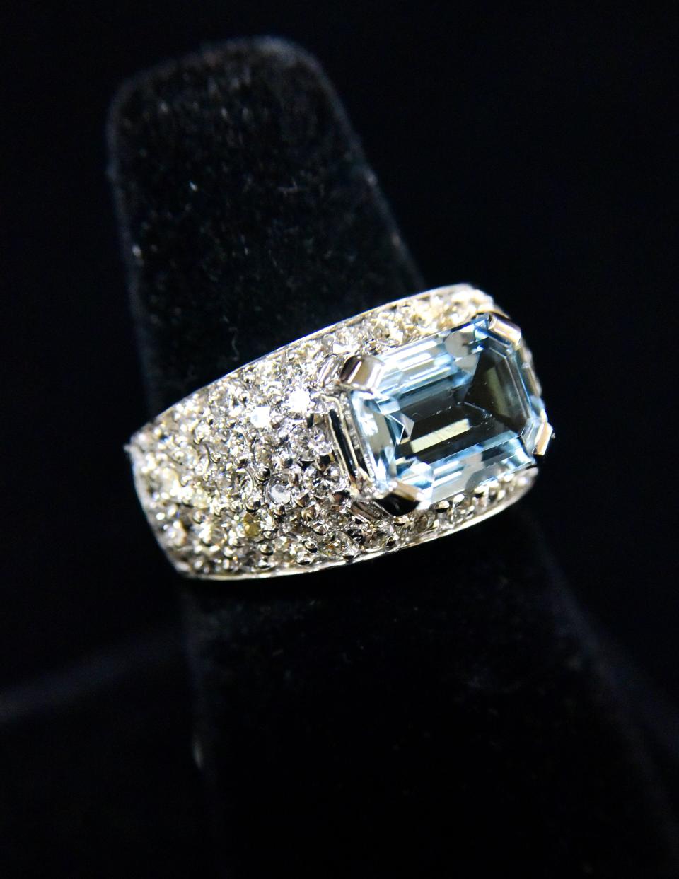 A 4k aquamarine ring with 2K in diamonds.