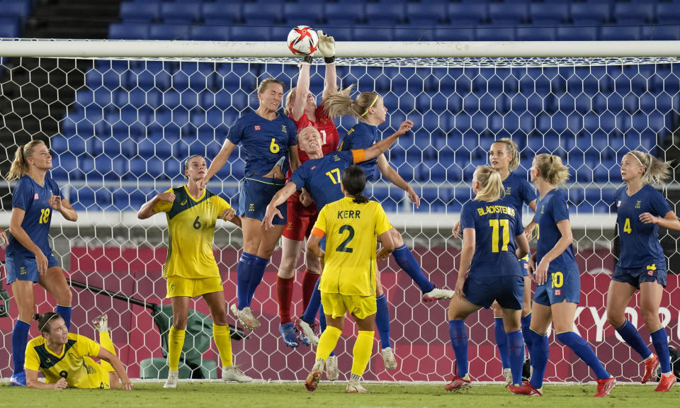 Sweden's goalkeeper Hedvig Lindahl clear the ball away on a corner kick during a women's semifinal soccer match against Australia at the 2020 Summer Olympics, Monday, Aug. 2, 2021, in Yokohama, Japan. (AP Photo/Silvia Izquierdo)