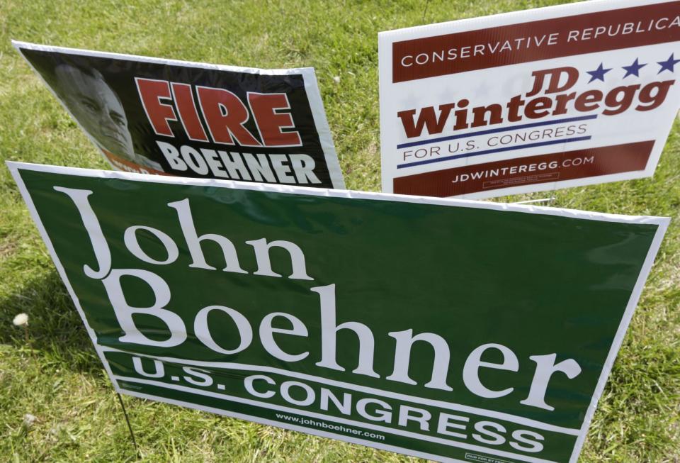 Campaign signs for Speaker John Boehner and one of his opponents, J.D. Winteregg, are posted on a road leading to a polling location, Tuesday, May 6, 2014, in West Chester, Ohio. Statewide a number of incumbent Republican lawmakers in Ohio face challengers in Tuesday's primary as they try to keep their seats this fall in the Statehouse and the U.S. Capitol. (AP Photo/Al Behrman)