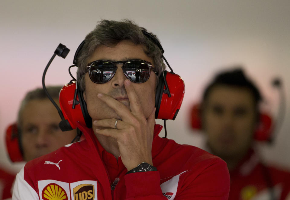 Ferrari's new team principal Marco Mattiacci, center, watches the monitor during the practice session ahead of Sunday's Chinese Formula One Grand Prix at Shanghai International Circuit in Shanghai, China Friday, April 18, 2014. (AP Photo/Andy Wong)