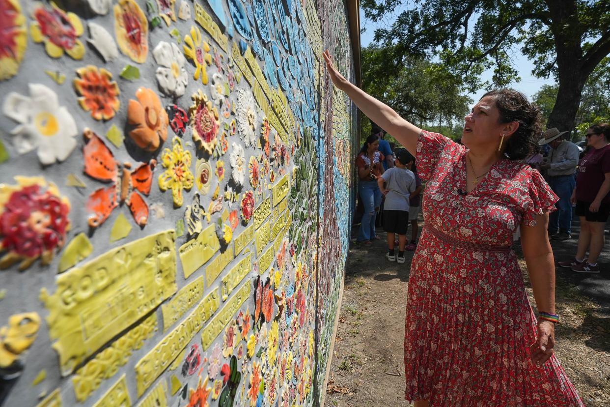 Artist Wanda Montemayor talks about the mural unveiled at Jardin de los Heroes Park in Uvalde on Saturday. Montemayor and the Uvalde Love Project created the mural using tiles made by more than 2,000 people as part of a yearlong art therapy project for the community and survivors of the 2022 Robb Elementary School shooting.