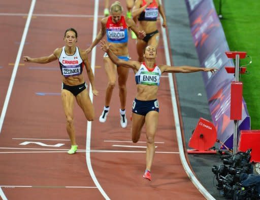 Britain's Jessica Ennis (front) celebrates as she crosses the finish line of the women's heptathlon 800m at the athletics event of the London 2012 Olympic Games