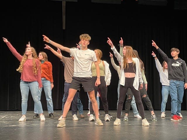Some of the principal dancers strike a pose on stage at a rehearsal of “9 to 5” held at Farragut High School Tuesday, Nov. 23, 2021.