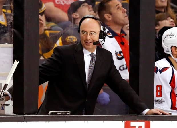 In this 2017, file photo, Pierre McGuire broadcasts from between the benches during the third period of an NHL game in Boston. He was most recently with NBC, which doesn't have the American broadcasting rights starting next season. (Winslow Townson/The Associated Press - image credit)