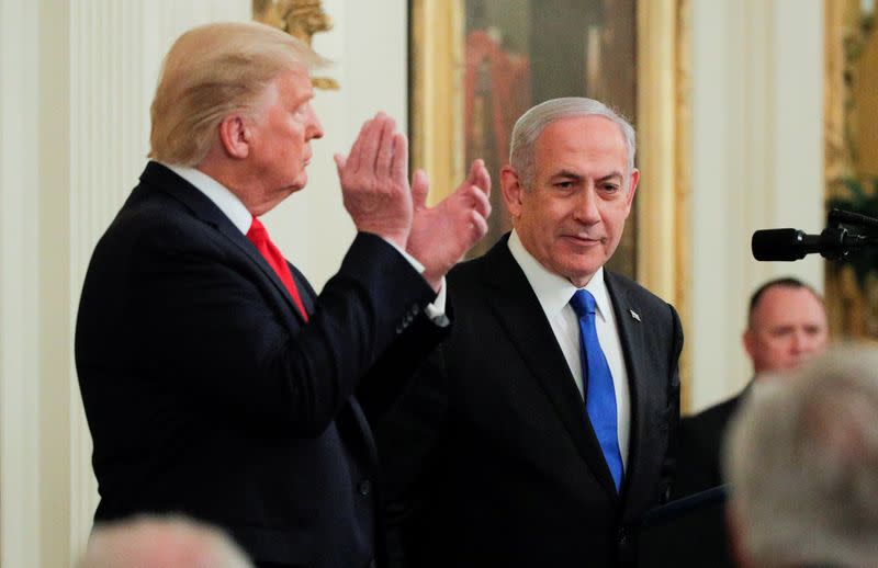 FILE PHOTO: U.S. President Trump applauds Israel's Prime Minister Netanyahu at Middle East peace proposal news conference at White House in Washington