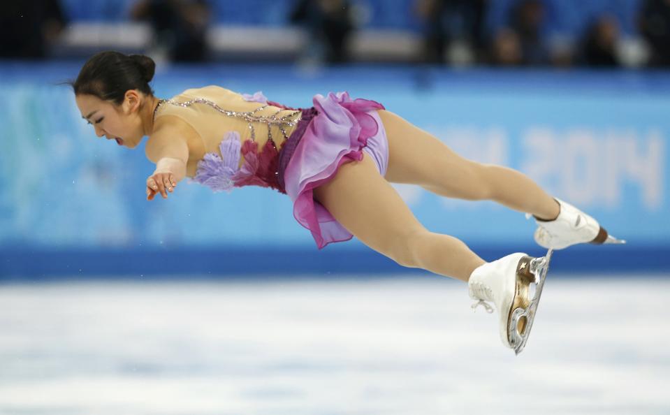 Mao Asada of Japan competes during the figure skating team ladies short program at the Sochi 2014 Winter Olympics, February 8, 2014. REUTERS/Alexander Demianchuk (RUSSIA - Tags: SPORT FIGURE SKATING OLYMPICS)