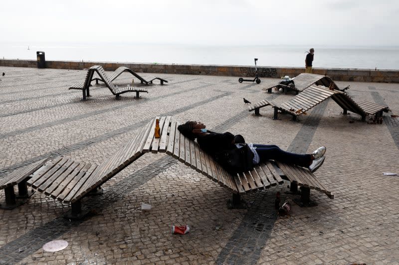 Woman rests during COVID-19 pandemic in Lisbon