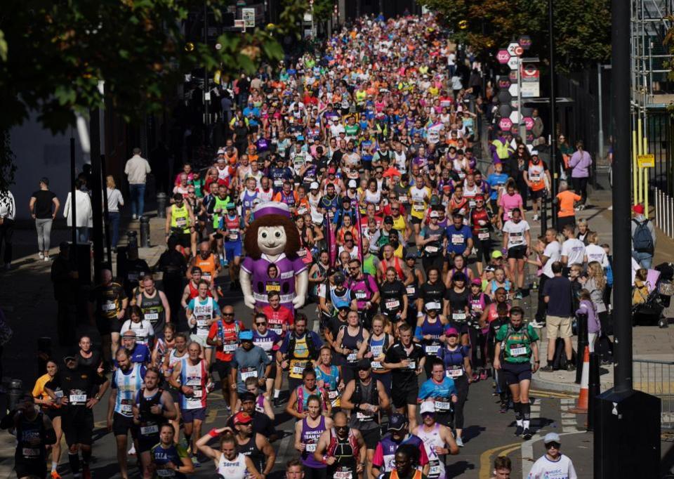 Watford Observer: Runners reach the Isle of Dogs during the TCS London Marathon on Sunday October 2, 2022.