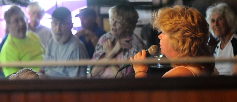 Doreen Williams sings during an Irish music jam at The Dubliner in 2015.