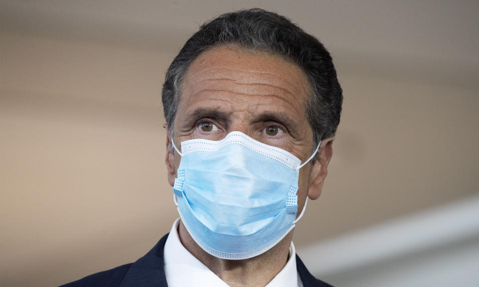 Gov. Andrew Cuomo wears a mask during a news conference at Laguardia Airport's Terminal B, Wednesday, June 10, 2020 in New York. The new terminal will open Saturday, June 13. (AP Photo/Mark Lennihan)