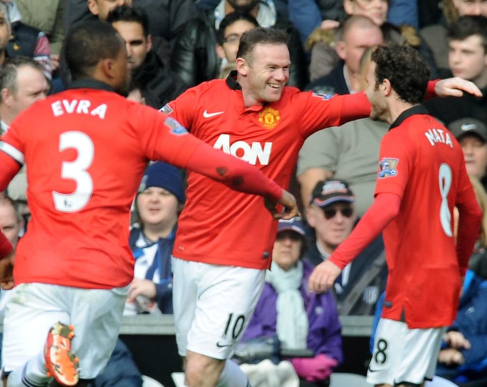 Manchester United's Wayne Rooney celebrates with Juan mata, right, and Patrice Evra after scoring against West Brom during the English Premier League soccer match between West Bromwich Albion and Manchester United at The Hawthorns Stadium in West Bromwich, England, Saturday, March 8, 2014. (AP Photo/Rui Vieira)