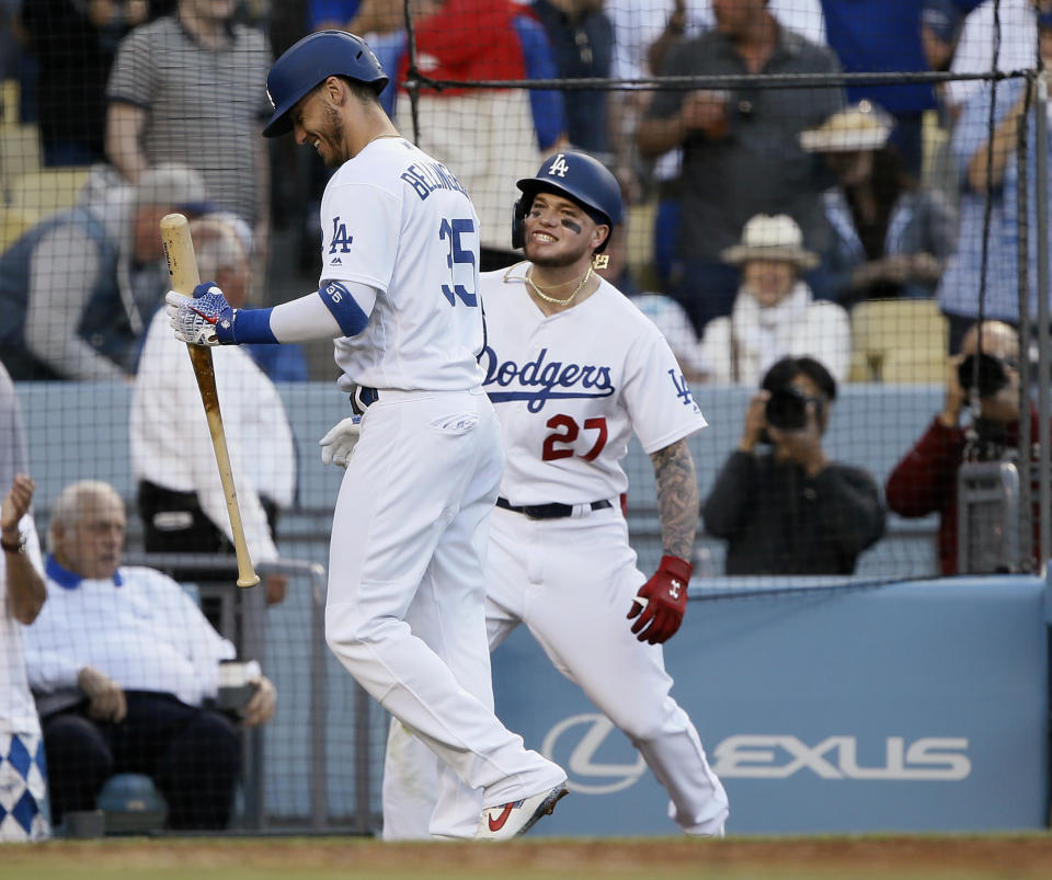 Los Angeles Dodgers' Alex Verdugo, right, and Cody Bellinger smile after Verdugo's solo home run against the Chicago Cubs during the fourth inning of a baseball game in Los Angeles, Saturday, June 15, 2019. (AP Photo/Alex Gallardo)