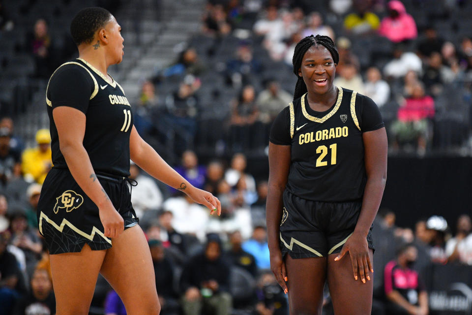 Colorado's Quay Miller (L) and Aaronette Vonleh celebrate during their season-opening win over LSU on Nov. 6, 2023 at T-Mobile Arena in Las Vegas. (Photo by Brian Rothmuller/Icon Sportswire via Getty Images)