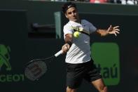 Mar 24, 2018; Key Biscayne, FL, USA; Roger Federer of Switzerland hits a forehand against Thanasi Kokkinakis of Australia (not pictured) on day five of the Miami Open at Tennis Center at Crandon Park. Mandatory Credit: Geoff Burke-USA TODAY Sports