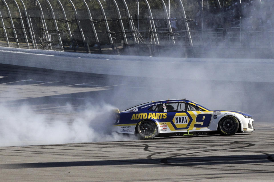 Chase Elliott does a burnout after winning a NASCAR Cup Series auto race, Sunday, Oct. 2, 2022, in Talladega, Ala. (AP Photo/Skip Williams)