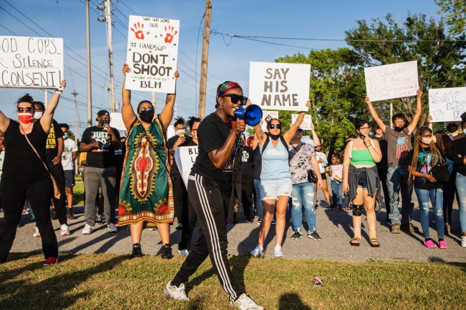 Demonstrators protesting the police shooting death of Andrew Brown Jr. block U.S. Highway 17 in Elizabeth City Tuesday, April 27, 2021. Elizabeth City is under an 8 p.m. curfew.
