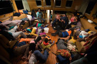 <p>Refugees from Eritrea rest inside the Astral vessel after being rescued from the Mediterranean sea, about 13 miles north of Sabratha, Libya, Monday, Aug. 29, 2016. Thousands of migrants and refugees were rescued Monday morning from more than 20 boats by members of Proactiva Open Arms NGO before transferring them to the Italian cost guards and others NGO vessels operating at the zone. (AP Photo/Emilio Morenatti) </p>