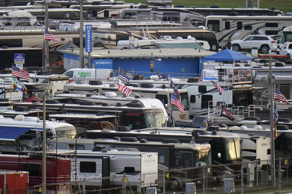 Motor homes are shown in the infield at the Daytona International Speedway before a truck race Friday, Feb. 12, 2021, in Daytona Beach, Fla. Daytona is used to shirtless fans partying in the infield. But what about maskless ones? Usually the biggest NASCAR party of the season, the sport will have to figure out how to police up to 30,000 fans who may have little interest in sticking to the pandemic guidelines. How many fans will actually come remains to be seen? (AP Photo/Chris O'Meara)