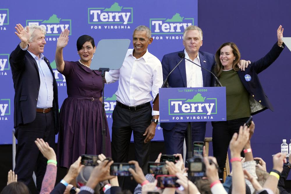 Former President Barack Obama, center, smiles at the crowd along with Democratic gubernatorial candidate, former Virginia Gov. Terry McAuliffe, second from right, his wife, Dorothy McAulffe, right, attorney general candidate Mark Herring, left, and lieutenant governor candidate Hala Ayala, second from left, during a rally in Richmond, Va., Saturday, Oct. 23, 2021. (AP Photo/Steve Helber)