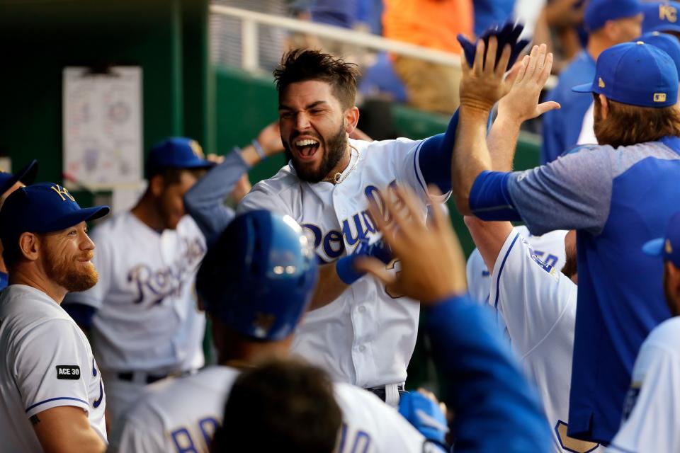 Eric Hosmer #35 of the Kansas City Royals is congratulated by teammates in the dugout after an official review confirmed he hit a three-run home run during the 4th inning of the game against the Minnesota Twins at Kauffman Stadium on June 30, 2017 in Kansas City, Missouri.