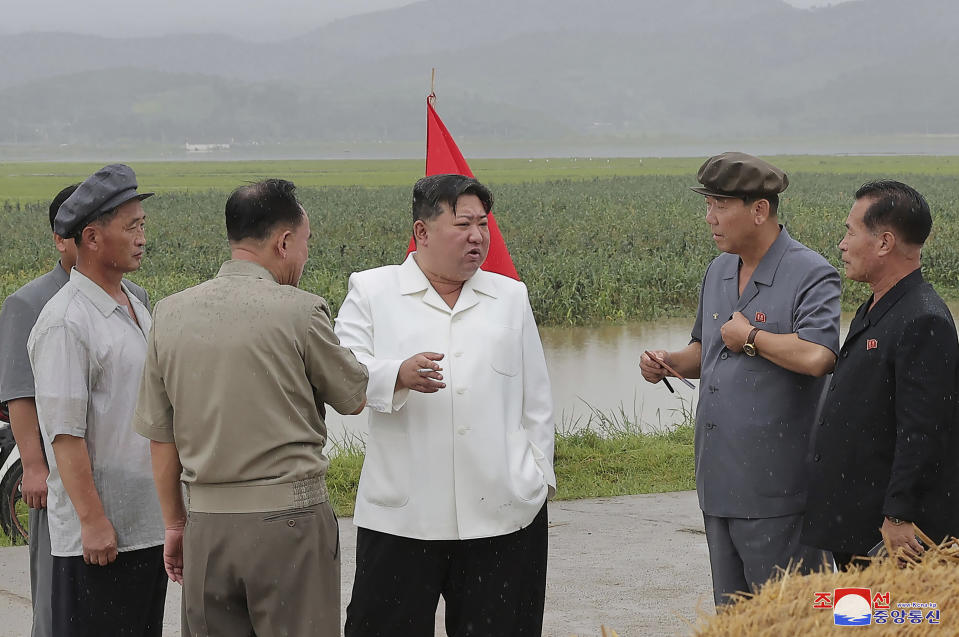 In this undated photo provided on Monday, Aug. 14, 2023, by the North Korean government, North Korean leader Kim Jong Un, center, visits storm Khanun-hit area at Anbyon County of Kangwon Province, North Korea. Independent journalists were not given access to cover the event depicted in this image distributed by the North Korean government. The content of this image is as provided and cannot be independently verified. Korean language watermark on image as provided by source reads: "KCNA" which is the abbreviation for Korean Central News Agency. (Korean Central News Agency/Korea News Service via AP)