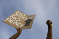 People take part in a demonstration in The Hague, Netherlands, Tuesday, June 2, 2020, to protest against the recent killing of George Floyd, police violence and institutionalized racism. Floyd, a black man, died in police custody in Minneapolis, U.S.A., after being restrained by police officers on Memorial Day. (AP Photo/Peter Dejong)