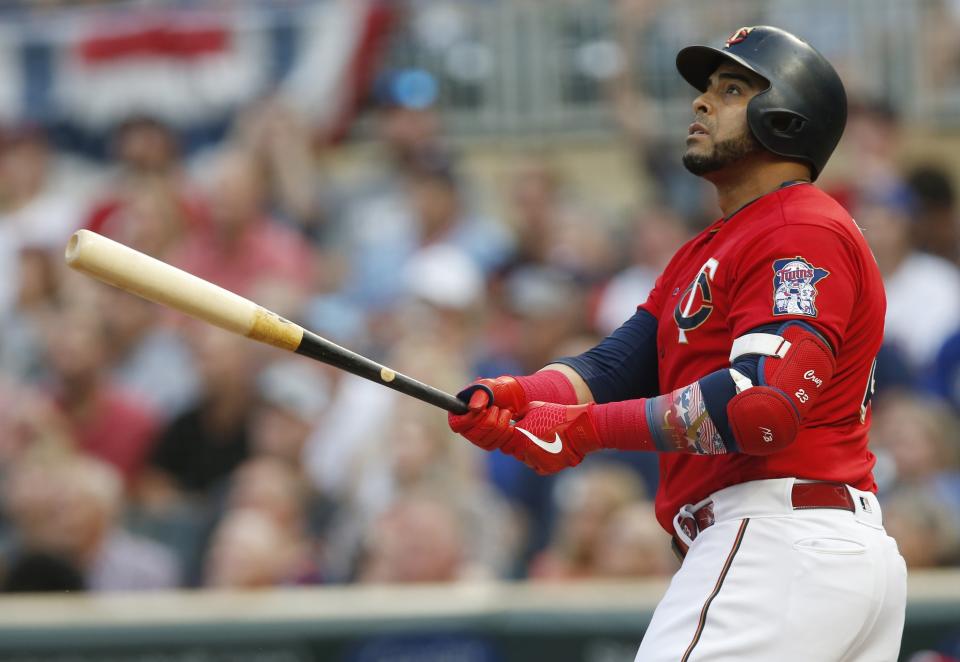 Minnesota Twins' Nelson Cruz watches his two-run home run off Kansas City Royals pitcher Glenn Sparkman during the first inning of a baseball game Friday, Aug. 2, 2019, in Minneapolis. (AP Photo/Jim Mone)