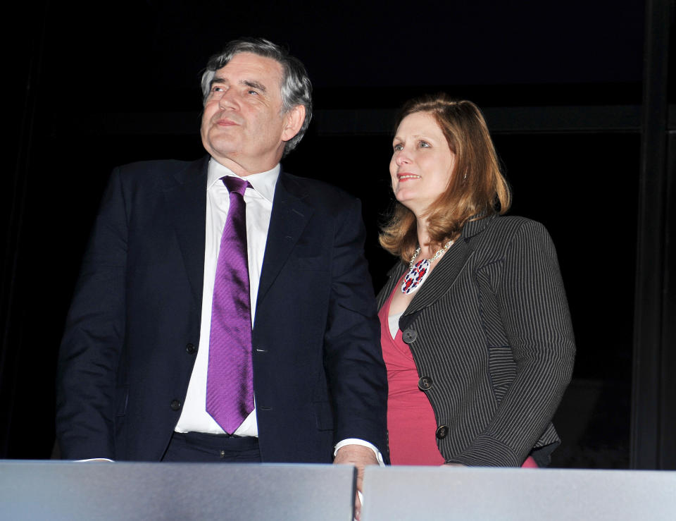 LONDON, ENGLAND - JULY 27: Former Prime Minister Gordon Brown and his wife Sarah look on ahead of the Olympic Games 2012 Opening Ceremony on July 27, 2012 in London, England. Athletes, heads of state and dignitaries from around the world have gathered in the Olympic Stadium for the opening ceremony of the 30th Olympiad. London plays host to the 2012 Olympic Games which will see 26 sports contested by 10,500 athletes over 17 days of competition. (Photo by John Stillwell - WPA Pool/Getty Images)