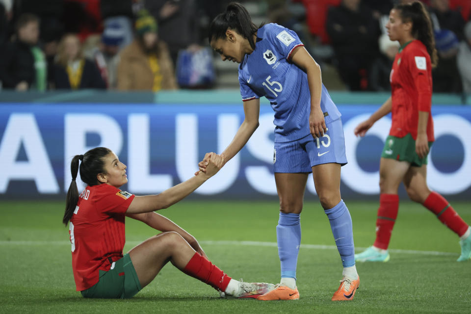 France's Kenza Dali, right, consoles Morocco's Nesryne El Chad following the Women's World Cup round of 16 soccer match between France and Morocco in Adelaide, Australia, Tuesday, Aug. 8, 2023. (AP Photo/James Elsby)