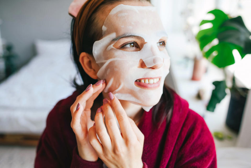 Woman taking off her face mask as part of a 'morning shed' skincare regime. (Getty Images)