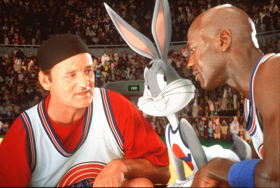 Bill Murray, Bugs Bunny, and Michael Jordan are shown in a scene from the Warner Bros. film &quot;Space Jam.&quot; The film, with a $48.5 million two-week box office take, marked the first time a rival has made a serious dent in Disney's virtual monopoly of the feature animation market.