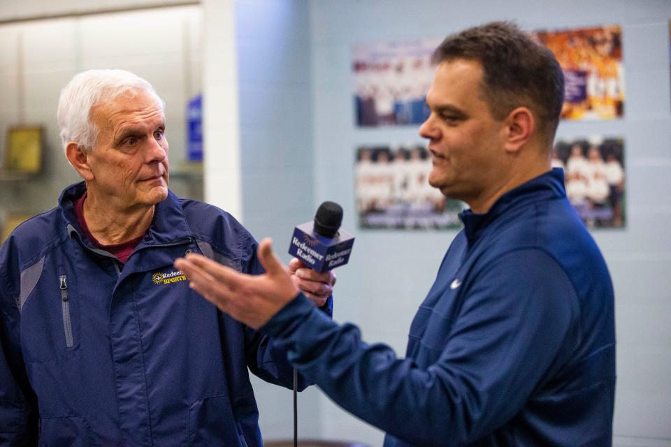 Bob Berger interviews Marian boys basketball coach Robb Berger Wednesday during Media Day at Bethel University.