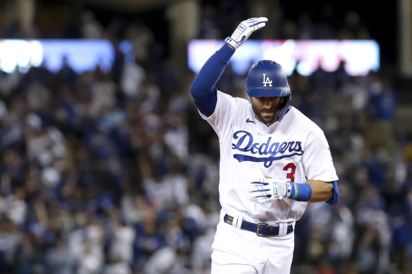 Los Angeles, CA - October 21: Los Angeles Dodgers' Chris Taylor rounds the bases after hitting a two-run home run.