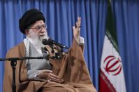 In this picture released by an official website of the office of the Iranian supreme leader, Supreme Leader Ayatollah Ali Khamenei speaks at a meeting with a group of Revolutionary Guards and their families, in Tehran, Iran, Tuesday, April 9, 2019. Khamenei praised Iran's Revolutionary Guard and said America's "evil designs would not harm" the force after the White House designated the guard a foreign terrorist organization. (Office of the Iranian Supreme Leader via AP)