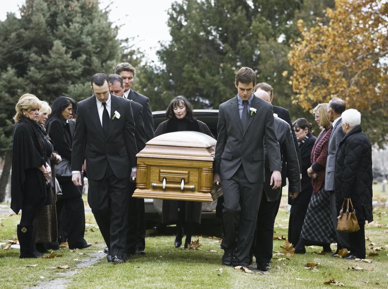 Homicides and the opioid epidemic both contribute to the rising U.S. death rates. <a href="https://www.gettyimages.com/detail/photo/people-at-a-funeral-royalty-free-image/104302939?phrase=U.S.+cemetery&adppopup=true" rel="nofollow noopener" target="_blank" data-ylk="slk:Rubber Ball Productions/Brand X Pictures via Getty Images;elm:context_link;itc:0;sec:content-canvas" class="link ">Rubber Ball Productions/Brand X Pictures via Getty Images</a>