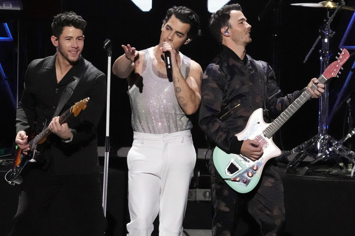 FILE - Nick Jonas, from left, Joe Jonas and Kevin Jonas of the Jonas Brothers perform at Z100's iHeartRadio Jingle Bal in New York on Dec. 10, 2021. The Jonas Brothers are scheduled to be on Broadway from March 14-18. (Photo by Charles Sykes/Invision/AP, File)